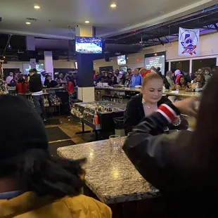 a woman sitting at a bar