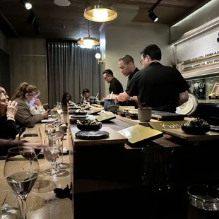 a group of people sitting at a table