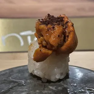 a close up of a sushi on a plate