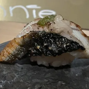 a piece of sushi on a plate