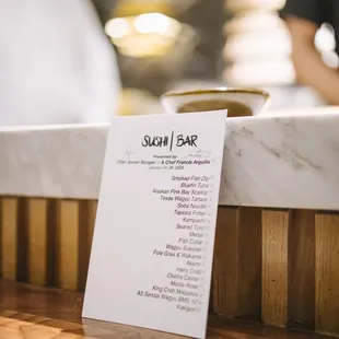 a menu on a counter