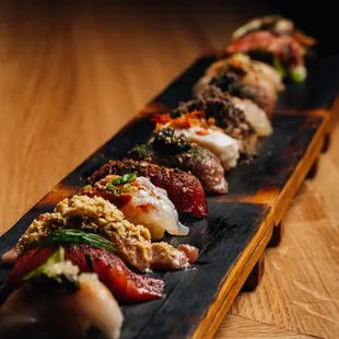 a long rectangular platter of sushi