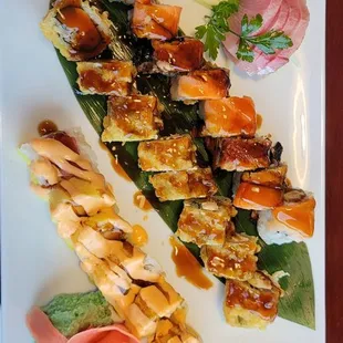 Left to right.  Sunshine, Yummy, Dinosaur rolls with yellowtail sashimi.  Soo freaking good.