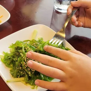 We get seaweed salad everywhere that offers it. Their's is great. Sorry for the hands...I couldn't get a pic fast enough