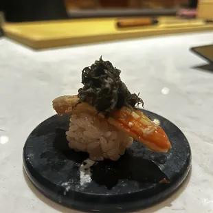 The crab nigiri with the optional truffle shaving on top. 10/10 I&apos;ll return for this bite alone.