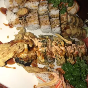 Detroit roll on the bottom, multiple orgasm roll, shrimp tempura, crunch roll, dirty blonde.