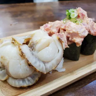 Off menu item - scallop nigiri.  To the right - Spicy tuna.