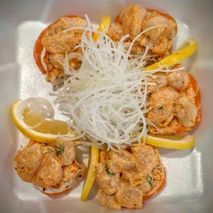 Dragon Ball Z - spicy crab, cucumber, avo wrapped in soy paper. Topped w/ salmon, spicy scallops, masago, green onion