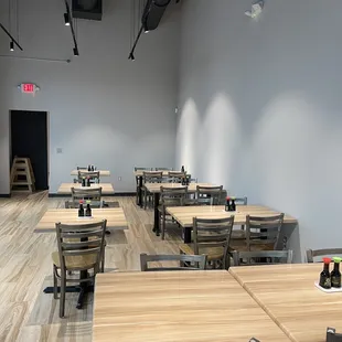 a restaurant with tables and chairs