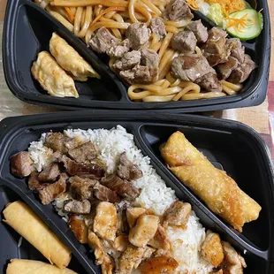 Teppanyaki Bento Box: Top: noodles, steak, dumplings, and salad. Bottom: white rice, steak, chicken, springrolls, and egg roll.