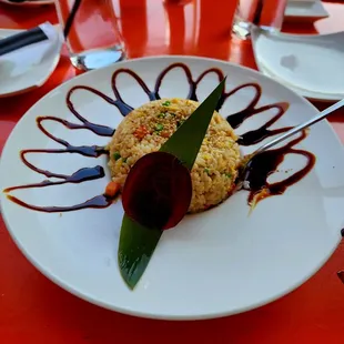 a plate of food on a red table