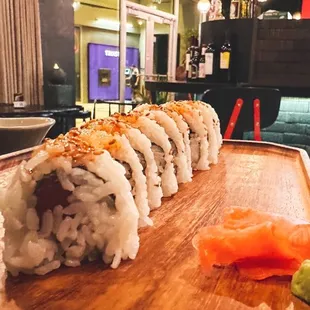sushi rolls on a wooden board