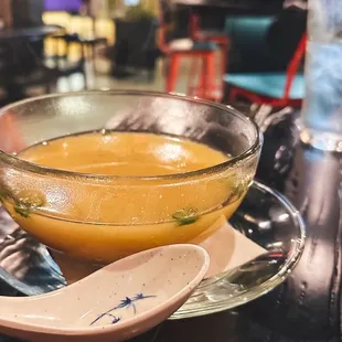 a bowl of soup and a spoon