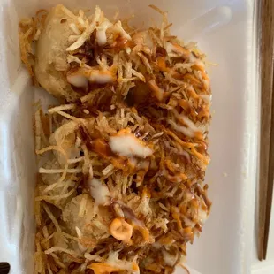 a close up of a sandwich in a styrofoam container
