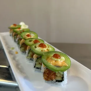 a sushi roll on a white plate