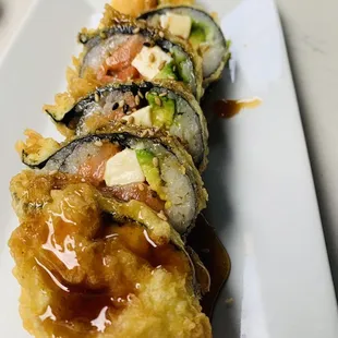 a plate of sushi rolls