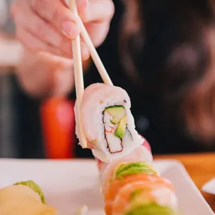 a woman eating sushi