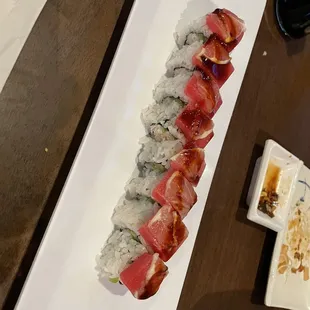 Sunrise roll. Note the thin slice of lemon on top.