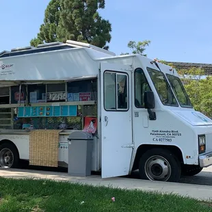 a food truck parked on the side of the road