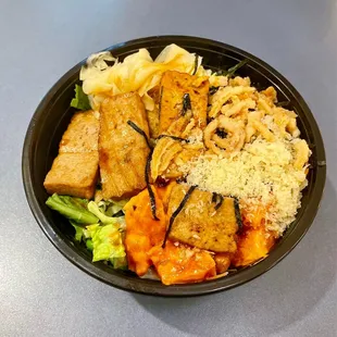 a bowl of sushi burrito