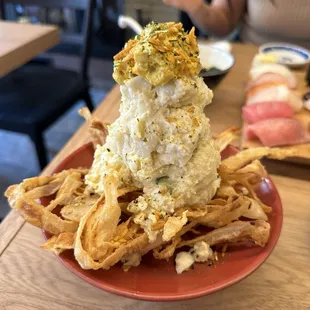 Potato salad on a bed of fried crispy onions