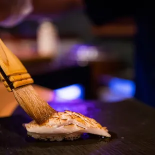 a sushi being prepared