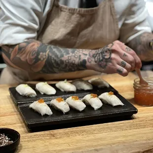  a chef preparing sushi