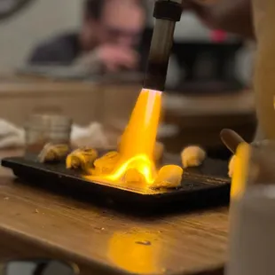  a person making a hot piece of food