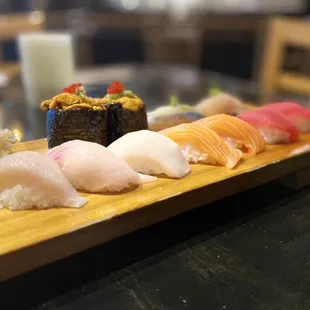 Uni (sea urchin), hamachi (yellowtail), shiro maguro (albacore tuna), sake (salmon), kihada (ahi tuna), saba (mackerel), and white tuna