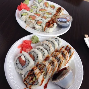 two plates of sushi on a table