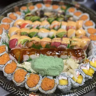 a platter of sushi and rolls