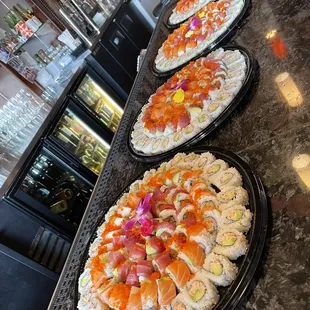 a variety of sushi on a counter