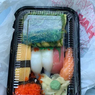 The Caterpillar roll; 2 pc squid, 1 pc egg, 1 pc tuna, 1 pc salmon, and 1 pc flying fish egg