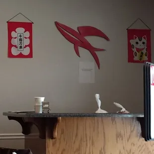 Behind the cashier's counter