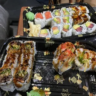 Takeout sushi post lunch front: salmon skin roll, shrimp tempura roll, back: Spicy tuna salmon avocado, eel avocado, and tuna avocado