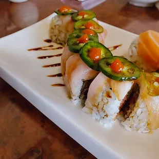 Hot night roll- eel, spicy tuna, and cucumber inside with yellowtail and jalapeño on top!