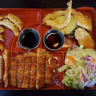 Dinner bento box- choose your own main dish with two sides! Comes with miso soup, house salad with our homemade sesame dressing, and rice!
