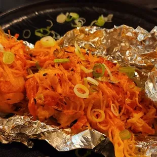 Imitation crab meat and scalloped topped muscles. Delicious.