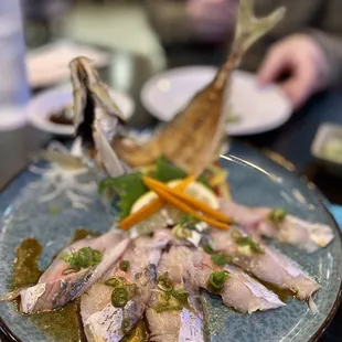 a plate of fish and vegetables