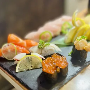 Ikura Sashimi, octopus, mackerel, Spicy Scallops Sashimi, Salmon Sashimi, Yellowtail Sashimi