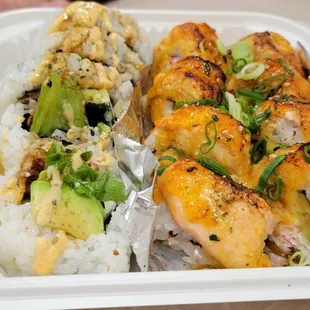 two take out containers of sushi