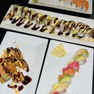 three plates of sushi on a table