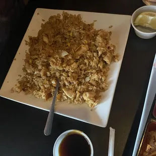 a plate of food and a bowl of sauce