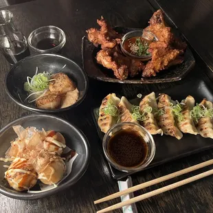 Takoyaki, seared scallops, karaage wings with gochujang, and pork gyoza