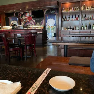 a man sitting at a table in a restaurant