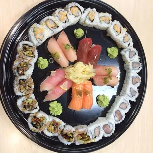 Spicy scallop, eel and yellowtail rolls with nigiri combo