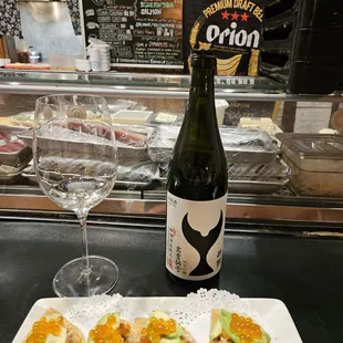 Mexican Japanese: Uni, Ikura Roe, Blue Crab Salad, Aguacate, Tortilla de Maíz. Suigèi Premium Sakè pairs excellently