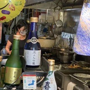 a woman preparing food in a restaurant kitchen