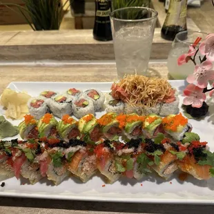 a plate of sushi and a glass of water