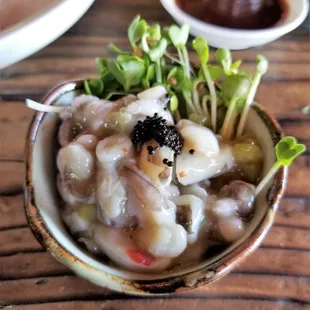 Raw baby octopus with caviar and micro daikon sprouts